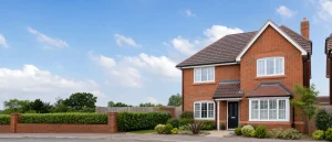 Suburban brick house with tiled roof, guttering and roof edge visible.